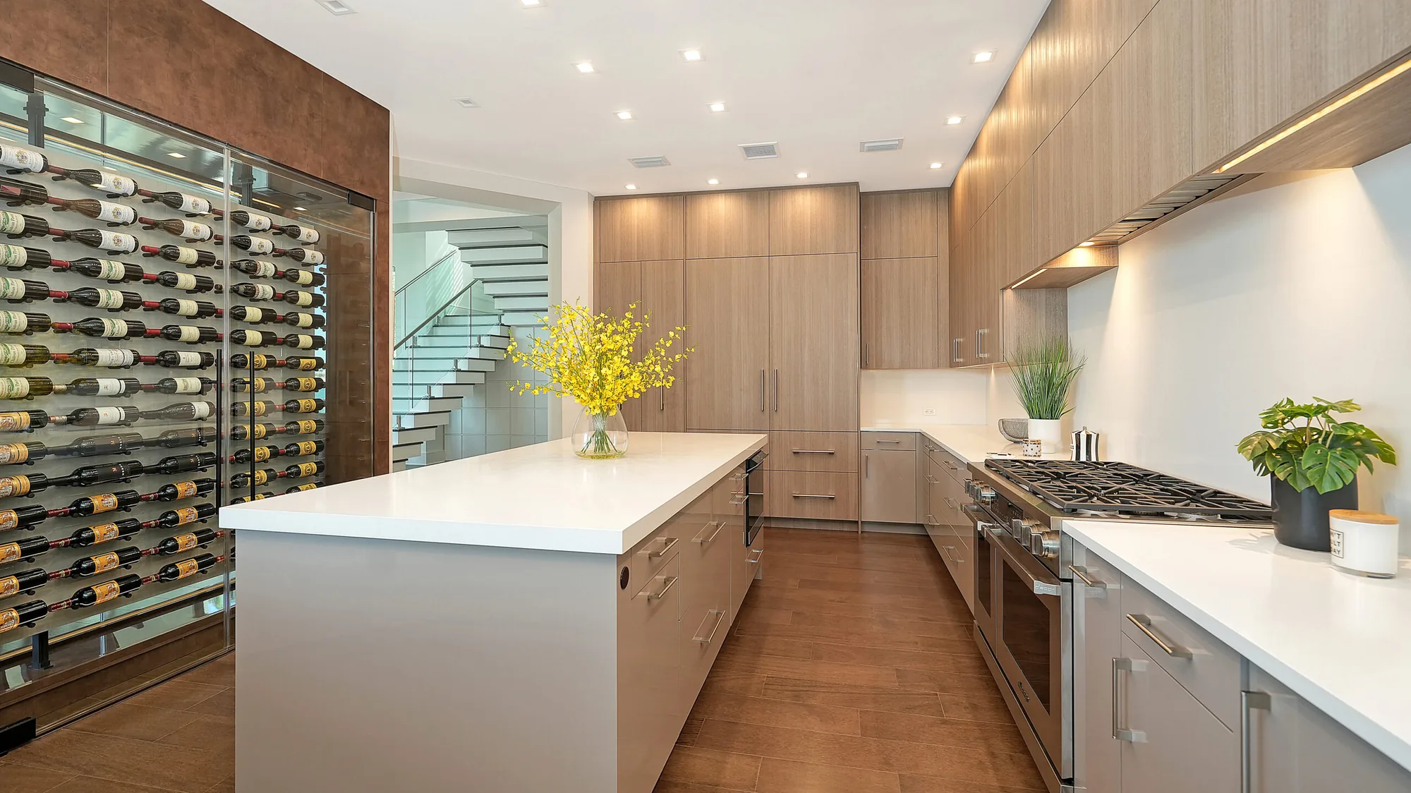 Metro Cabinet Company galley kitchen with a wine wall, island, and full-height cabinet bank